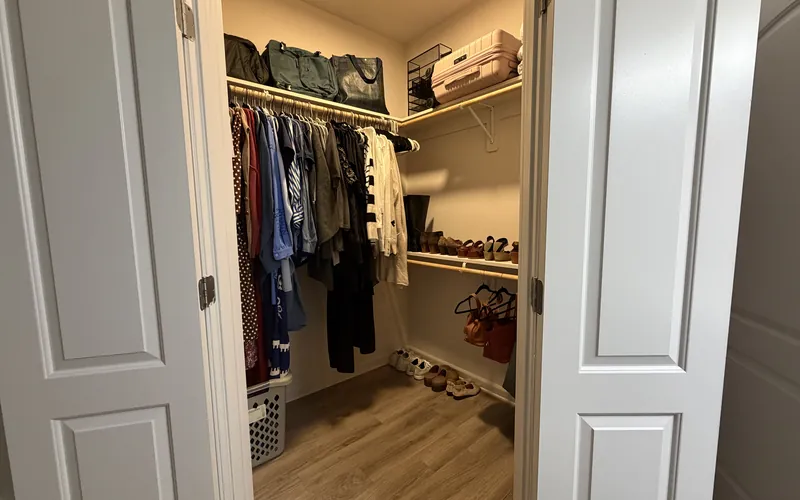 Neatly organized closet after a Tidy Standard home organizing session