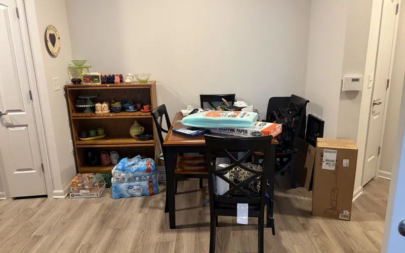 Dining area with clutter before a cleaning and organizing session