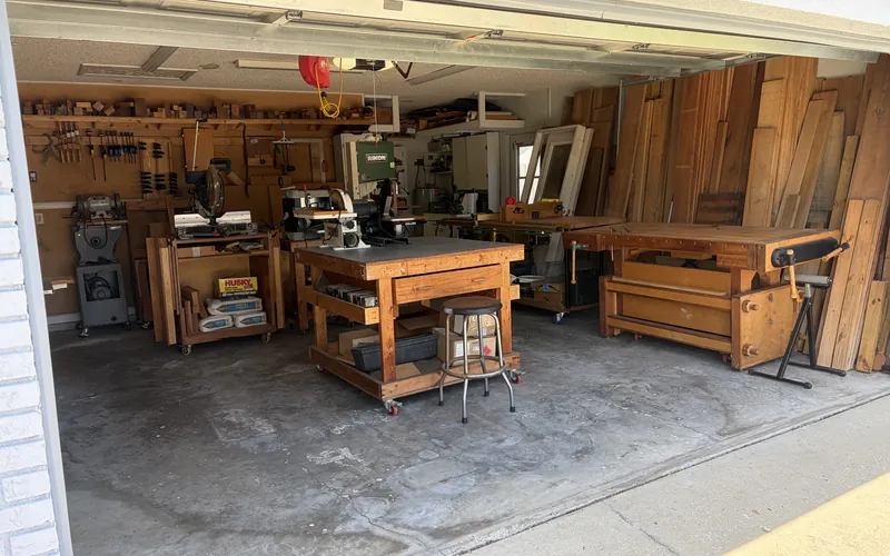 Organized garage workshop after a Tidy Standard organizing session