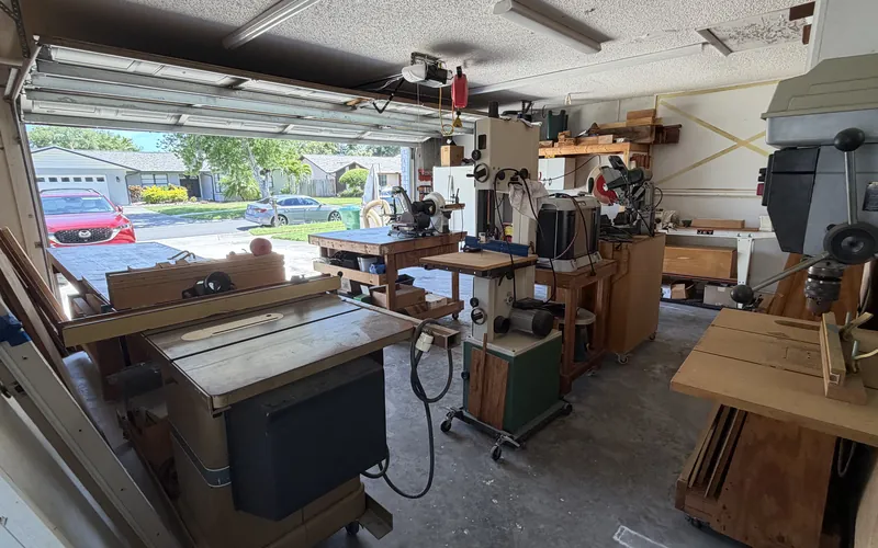 Cluttered garage workshop before an organizing session