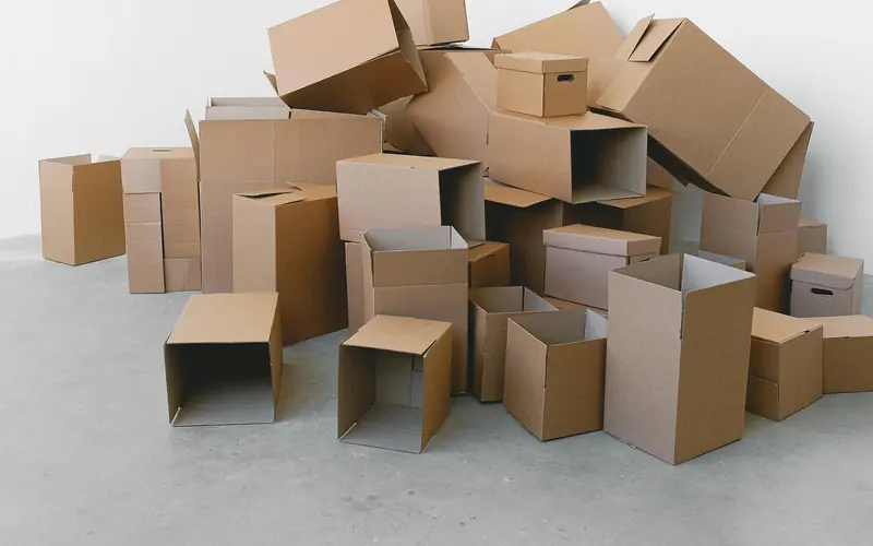 Moving boxes in an empty room ready for cleaning
